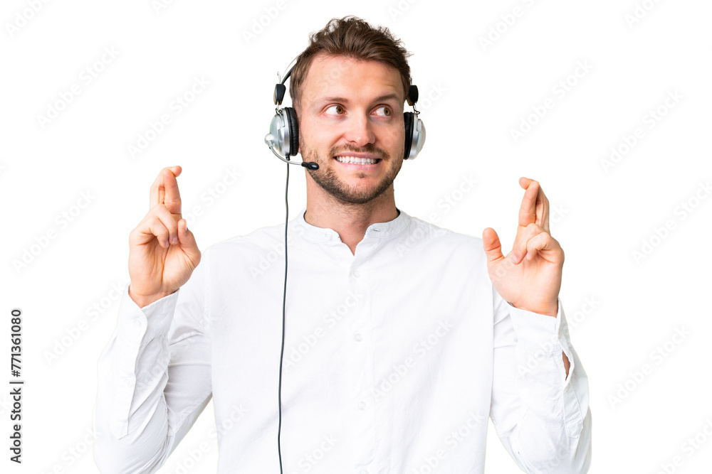 Telemarketer caucasian man working with a headset over isolated chroma key background with fingers crossing Telemarketer caucasian man working with a headset over isolated chroma key background with fingers crossing