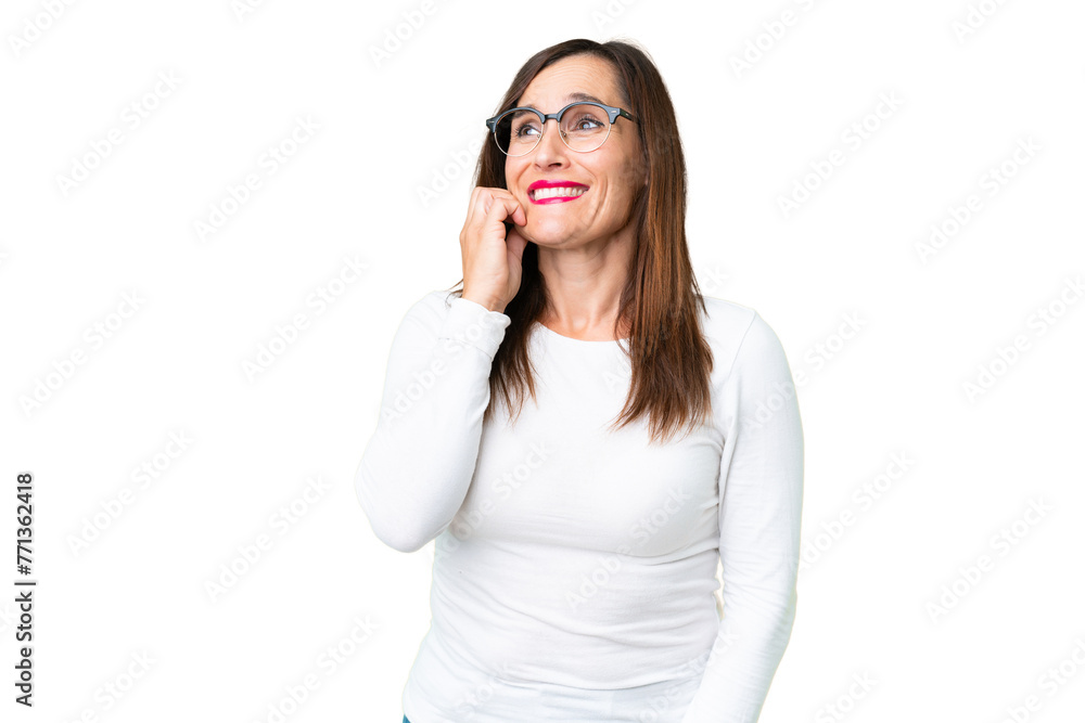 Middle age woman over isolated chroma key background is a little bit nervous Middle age woman over isolated chroma key background is a little bit nervous