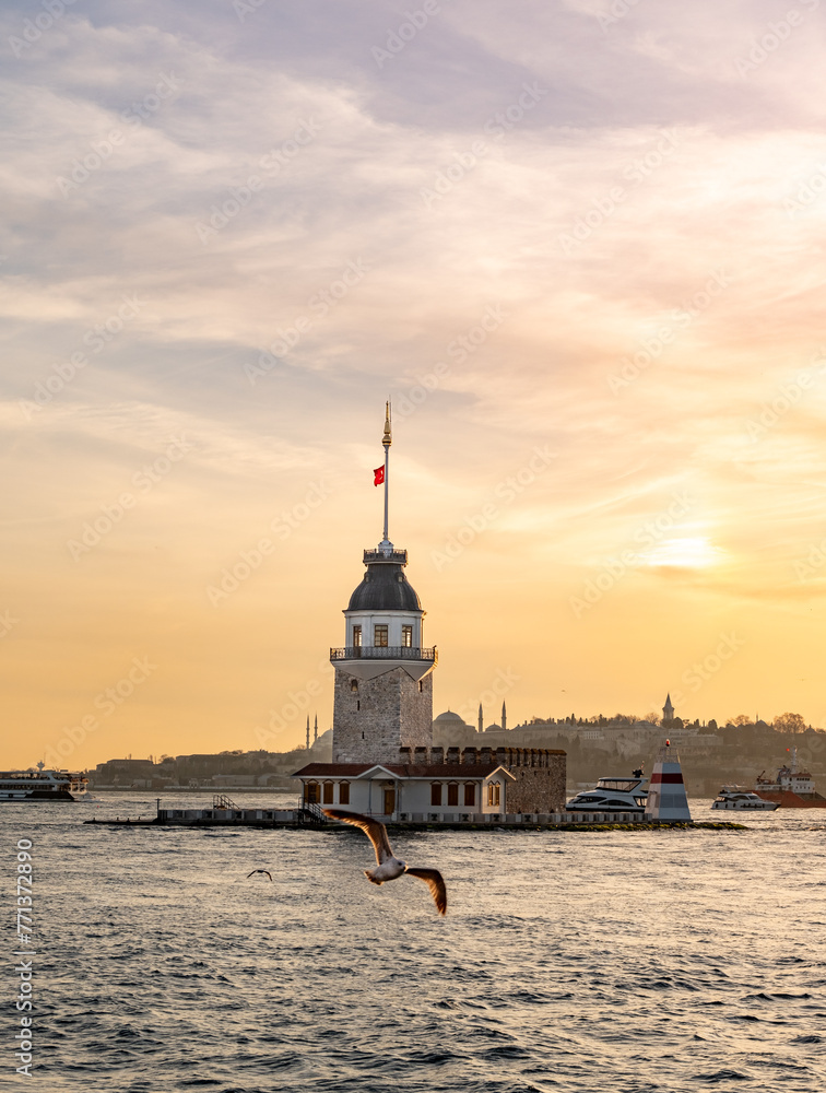 Beautiful sunset over Bosphorus with famous Maiden's Tower (Kiz Kulesi) also known as Leander's Tower, symbol of Istanbul, Turkey. Scenic travel background.