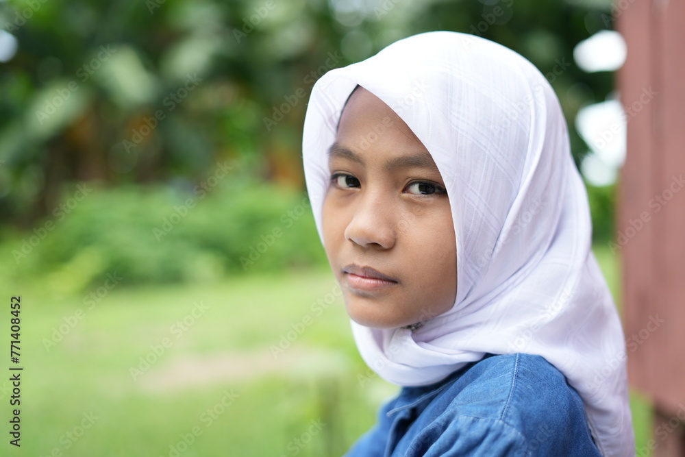 Portrait of an Asian girl wearing a white hijab Portrait of an Asian girl wearing a white hijab