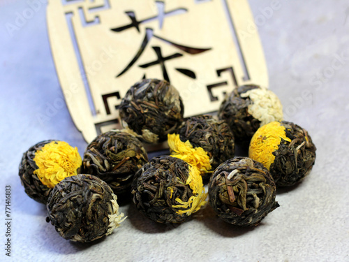 Chinese tied tea on a wooden stand