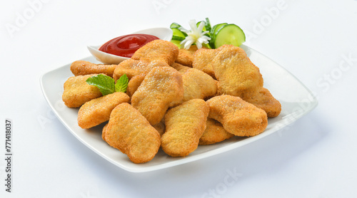 Chicken Nuggets. A chicken nugget is a food product consisting of a small piece of deboned chicken meat that is breaded or battered, then deep-fried or baked.