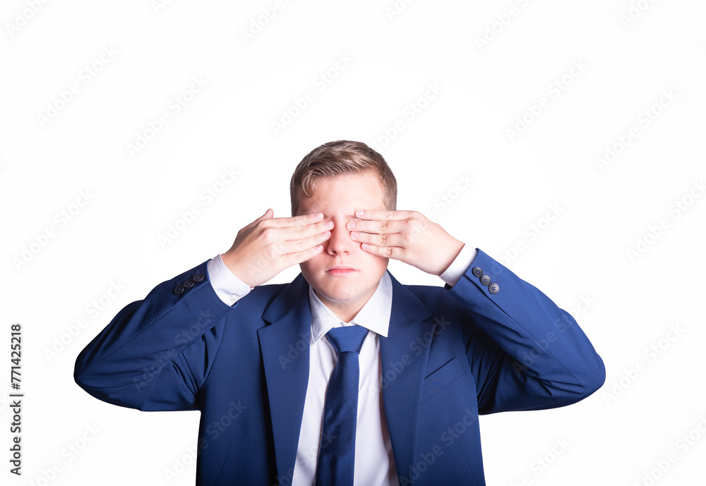 Businessman covering his eyes isolated on a white background Businessman covering his eyes isolated on a white background