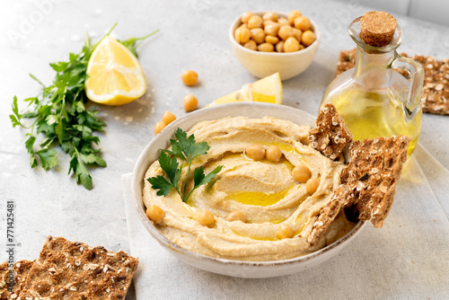 Traditional hummus with chickpea olive oil and lemon with multigrain crackers