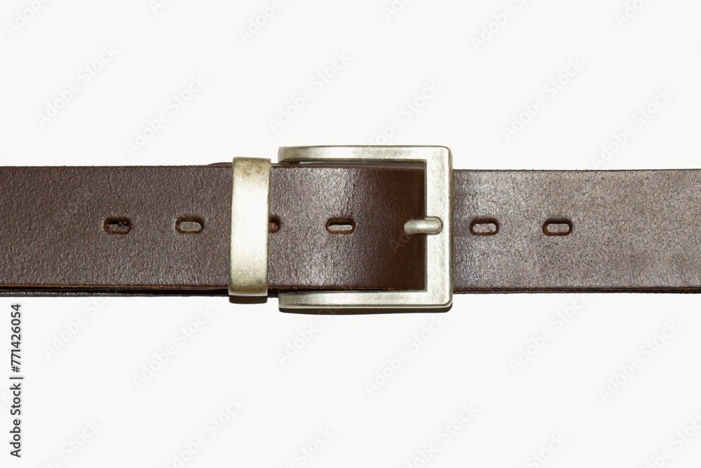 Men's brown leather belt with a metal buckle on a white background. Men's brown leather belt with a metal buckle on a white background.