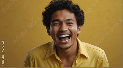 young indonesian man on plain bright yellow background laughing hysterically looking at camera background banner template ad marketing concept from Generative AI