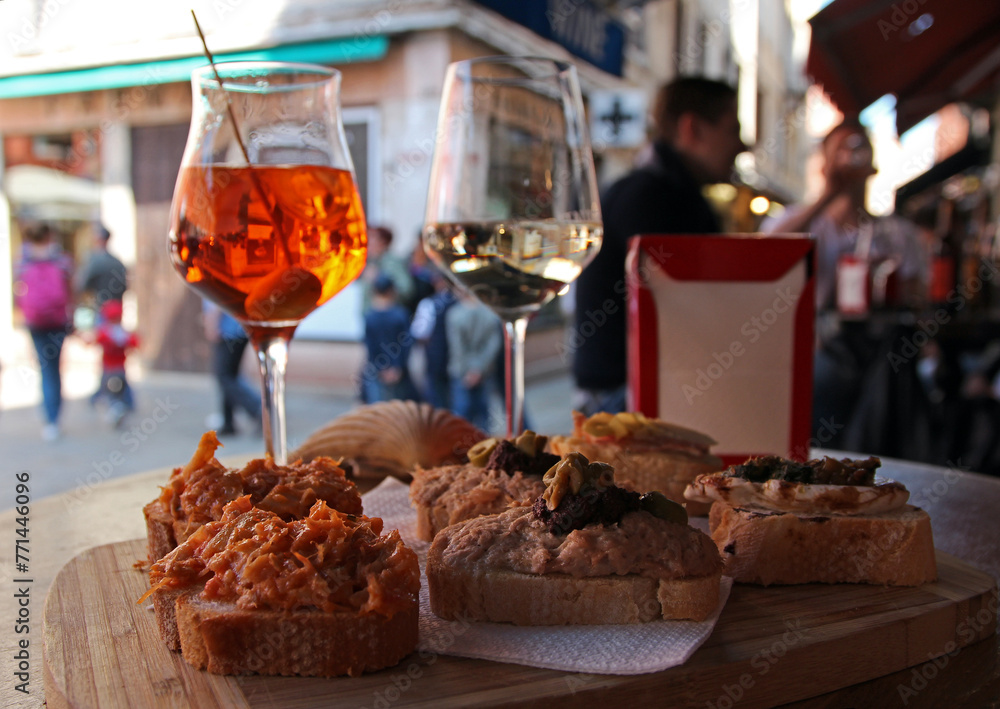 Aperol and wine with antipasti appetizers in an italian restaurant in Venice