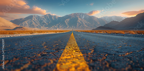 photograph of yellow road lines leading to the horizon, mountains in the background, sunset, cinematic. The photograph depicts yellow road lines leading to the horizon with mountains in the background