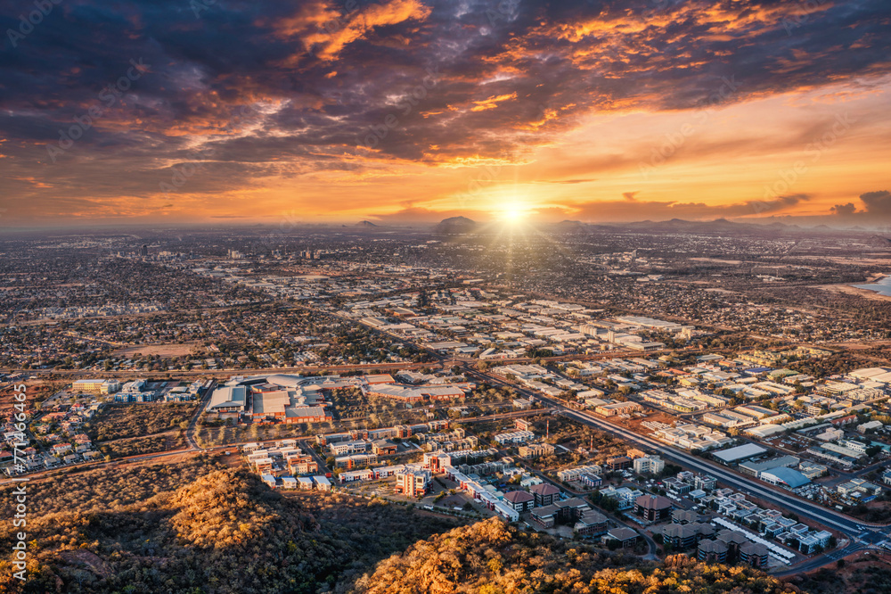 aerial view of gaborone capital city of Botswana at sunset, gaborone dam industrial and residential neighborhood late afternoon, high altitude