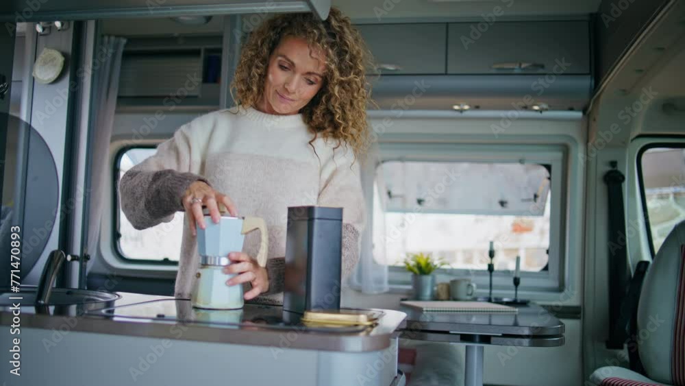 Relaxed woman making coffee in trailer kitchen closeup. Lady cooking in van Relaxed woman making coffee in trailer kitchen closeup. Lady cooking in van