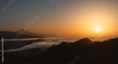 Beautiful sunset scenery with clouds over the ocean and volcano Teide. Tenerife, Spain.