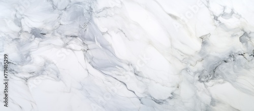A close up of a grey and freezing white marble texture resembling a snowy slope or ice cap, showcasing a winter event with a unique pattern resembling a glacial landform formed by water photo