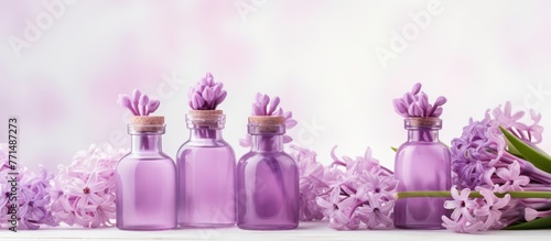 A display of purple glass bottles filled with violet flowers adds a touch of elegance to the table, creating a stunning visual of liquid in drinkware