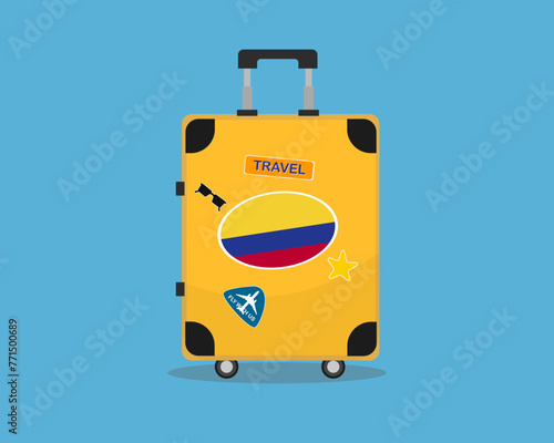 Suitcase or baggage with Colombia flag, holiday and vacation idea