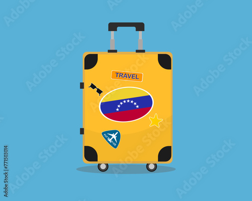 Suitcase or baggage with Venezuela flag, holiday and vacation idea