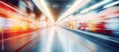 a blurry picture of a train going through a tunnel . High quality © AkuAku