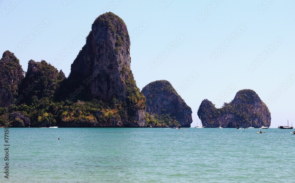 Tranquil seascape with majestic cliffs in the background. Thailand, Railay Beach.