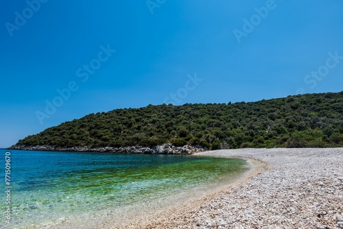 Fototapeta Naklejka Na Ścianę i Meble -  Stunning, pristine beach with a rocky shoreline and crystal clear blue waters, Antalya, Turkey