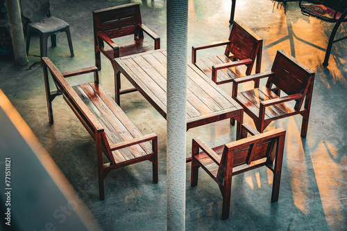 A set of wooden tables for sitting and eating.