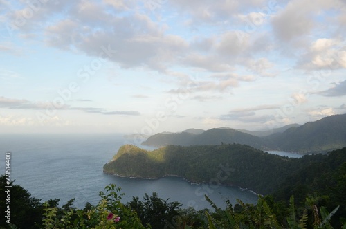 Fototapeta Naklejka Na Ścianę i Meble -  Scenic view of a tropical island set against a backdrop of the blue sea and sky
