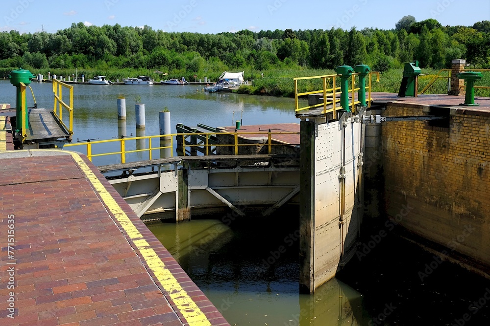 Lock gates of the water dam in river. Dam on river Nogat in Biala Gora (Biała Góra). Lock gates of the water dam in river. Dam on river Nogat in Biala Gora (Biała Góra).