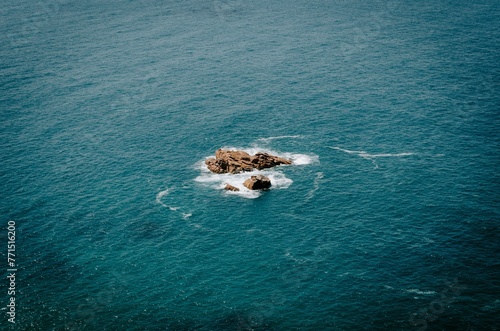 Waves hitting rocks in the Atlantic Ocean, seen at Cabo da Roca Portugal © Wirestock