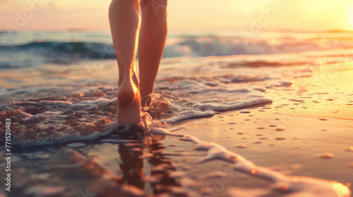 Barefoot walk on the shoreline at sunset. Wellness  travel experiences and summer vacation concept.