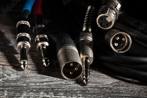 audio xlr trs cable plugs on wood background © bergamont