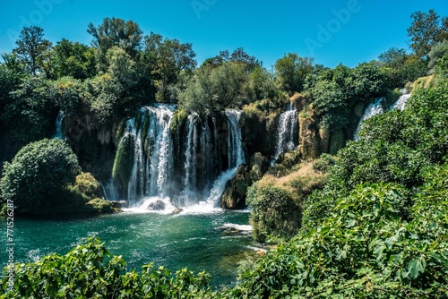 there are two waterfalls and a river that runs over them