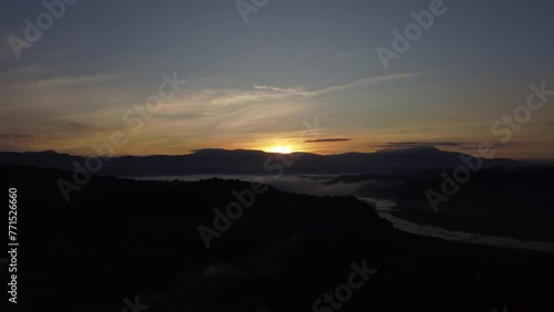 Wallpaper Mural Drone view over a river between dark landscapes with a misty fog during sunrise Torontodigital.ca