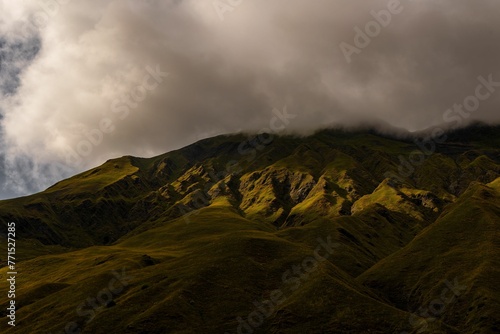 Stunning mountain range with rolling hills and lush green grass carpeting the landscape, Georgia