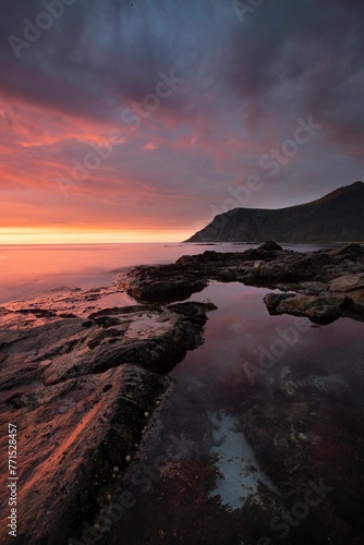 Tranquil evening scene of a rocky shore and sea. Norway, Lofoten.