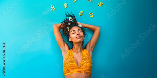 Chica soñando con signos del dólar alrededor de su cabeza photo