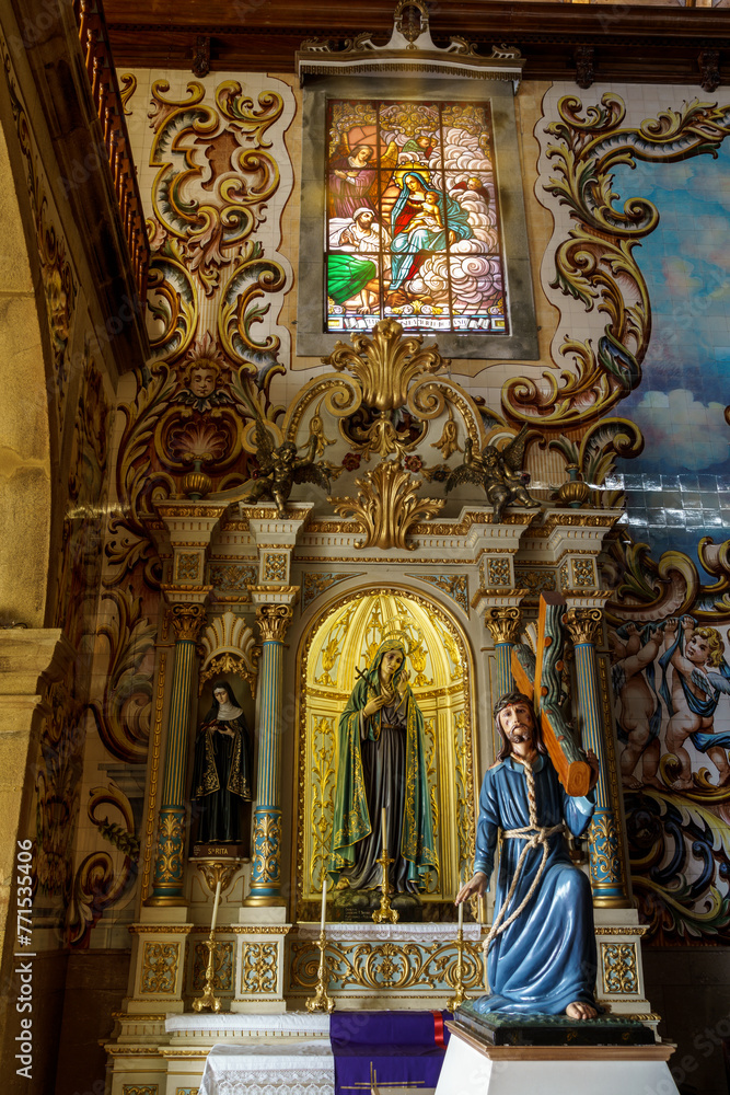 elaborate ornate church interior depicting religious scenes showing the alter and portico's