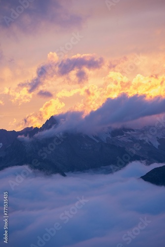 Vertical shot of sunset clouds over the Alps in Switzerland