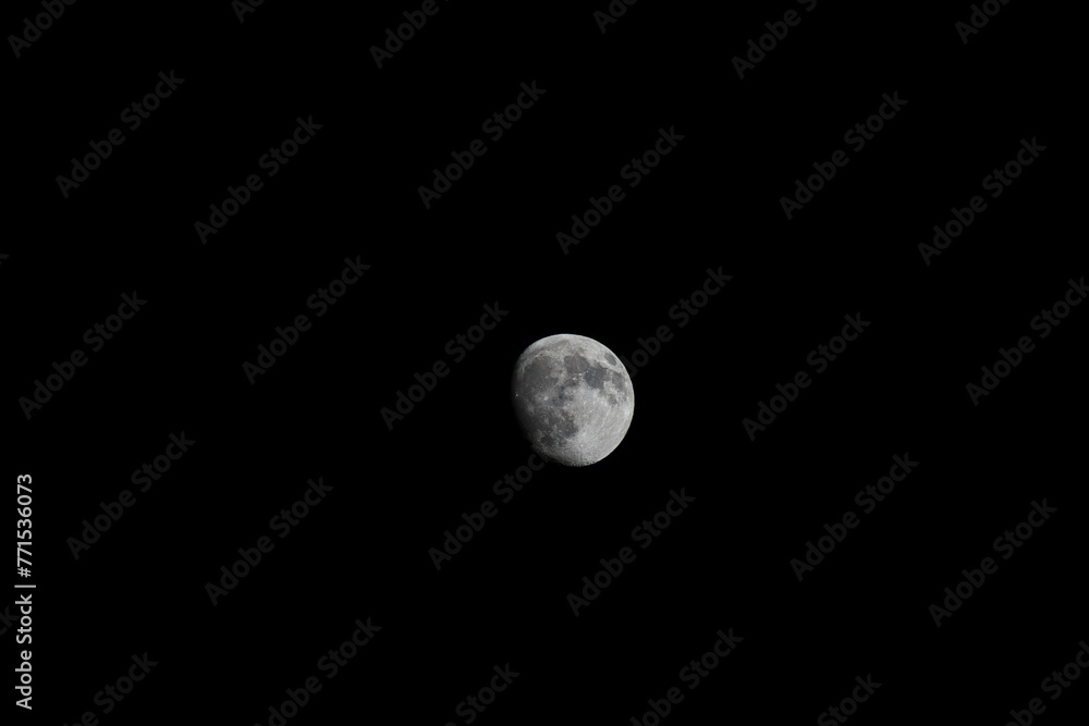 View of a tranquil night sky with a crescent moon View of a tranquil night sky with a crescent moon