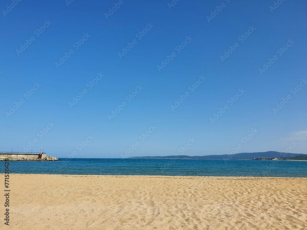 Scenic View Of Calm Sea Against Clear Sky. Beach and sea. Waves on the beach. Scenic View Of Calm Sea Against Clear Sky. Beach and sea. Waves on the beach.