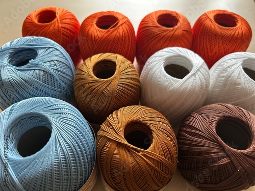 spools of threads, colourful threads on the table 