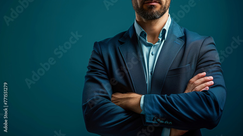A confident businessman in business attire with crossed arms, isolated on dark blue background with copy space for text message or advertising design