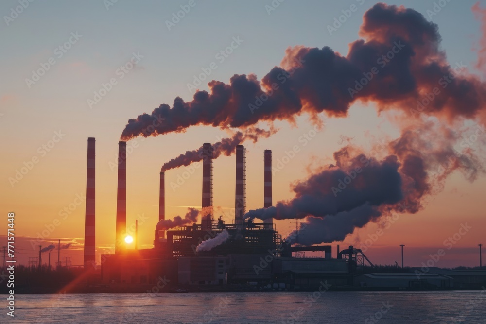Factory with tall smokestacks emitting smoke. Industrial scene with environmental impact