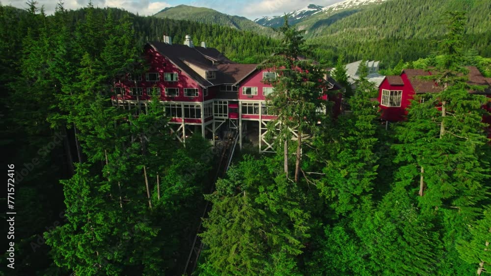 Drone shot of red houses in the middle of a forest in Ketchikan. Drone shot of red houses in the middle of a forest in Ketchikan.