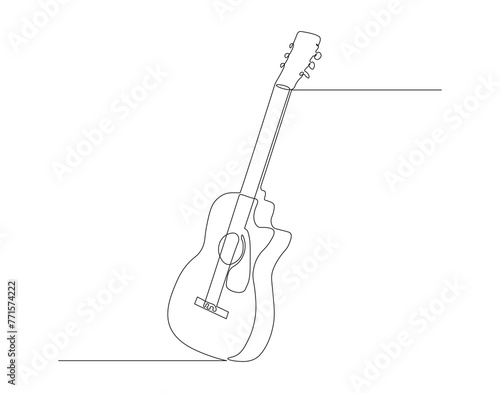 Continuous line drawing of classic acoustic guitar. One line of guitar acoustic. Modern stringed music instruments concept continuous line art. Editable outline. © TiyoSakhi