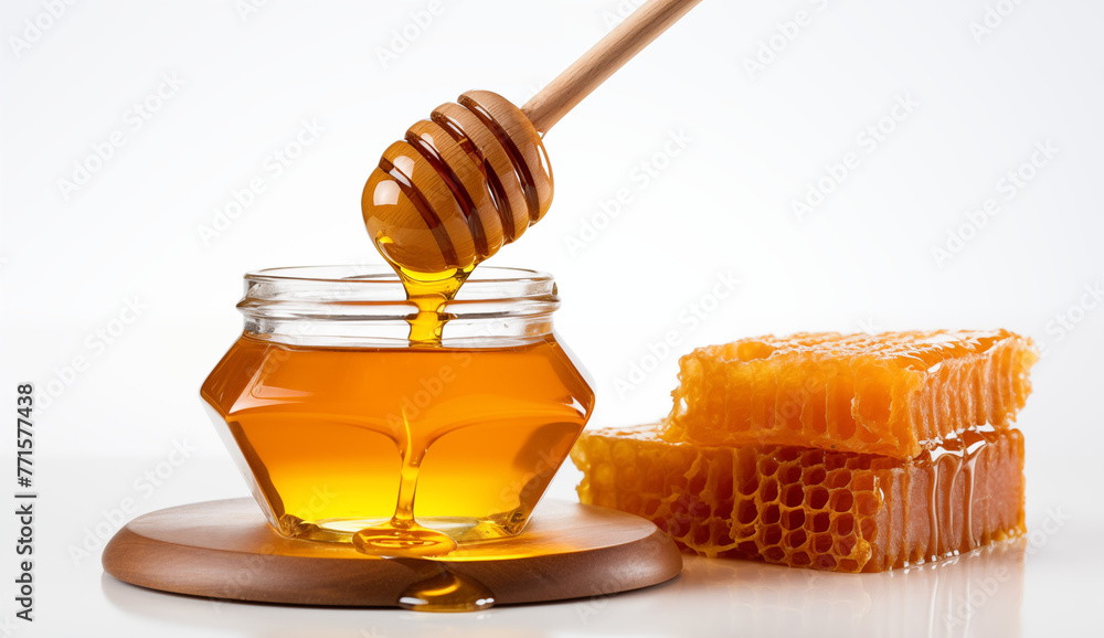 wooden dipper next to jar of honey and honey bee comb, A jar of honey with a dipper against white background wooden dipper next to jar of honey and honey bee comb, A jar of honey with a dipper against white background
