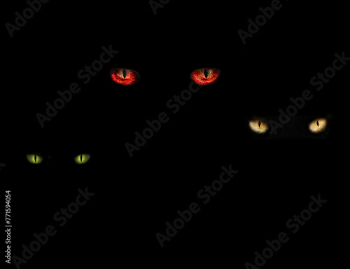 eyes of different colors of three monsters on a black background