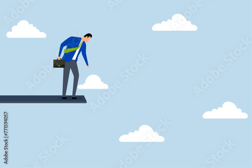 financial risk to fall down from economic recession, businessman standing on a wood jumping high in the sky looks down in fear.