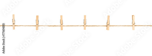 wooden clothespins on clothesline isolated white background. household сlothes pins on a jute rope