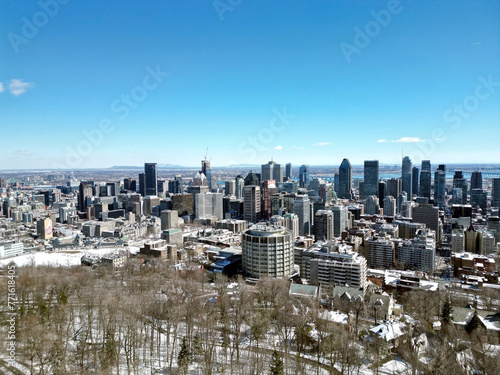 Aerial Drone of Montreal, Quebec Canada Downtown Cityscape Reveal View From Above the Trees of Mont-Royal
