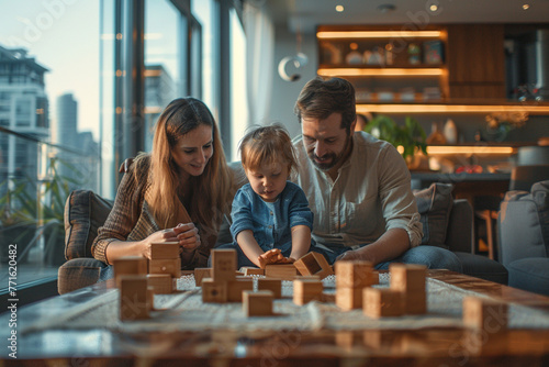 Carefree couple relaxing on sofa, little daughter play wooden cubes seated at table on floor, family spend pastime in modern apartment in skyscraper building. Leisure, new home, bank loan, tenancy