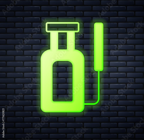 Glowing neon Garden sprayer for water, fertilizer, chemicals icon isolated on brick wall background. Vector