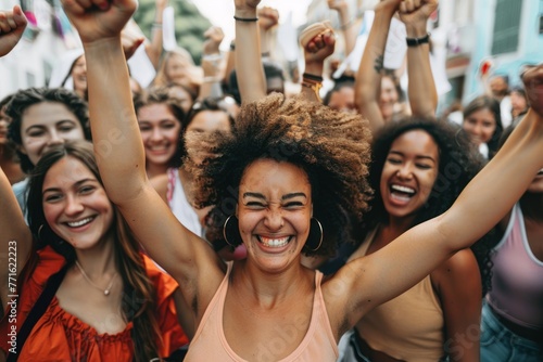 Large group of confident women celebrating in the streets photo
